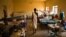 FILE - A man walks in a ward inside a hospital in Juba, South Sudan, Dec. 28, 2013.