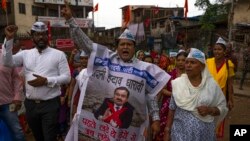 A group of people raise slogans opposing redevelopment of Dharavi, one of Asia's largest slums, through the Adani Group during a protest in Mumbai, India, Aug. 9, 2023. The protestors are demanding that the government withdraw the project from Adani. 