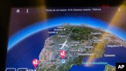 FILE - The flight path of flight AF995 is displayed on a passenger's screen as the plane flies over Botswana on its way to Paris from Johannesburg Monday Dec. 21, 2020.