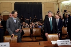 Top U.S. diplomat in Ukraine William Taylor, and career Foreign Service officer George Kent, left, arrive to testify before the House Intelligence Committee on Capitol Hill in Washington.