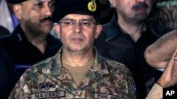 FILE - In this July 26, 2016 photo, Lt. Gen. Naveed Mukhtar attends funeral prayers in Karachi, Pakistan. 