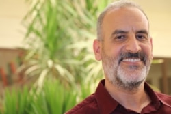 Hussein Ben Atya, the mayor of Tajoura, the Tripoli suburb where dozens of people were killed when airstrikes hit a migrant detention center, says continued war would be "a disaster," July 8, 2019. (H.Murdock/VOA)