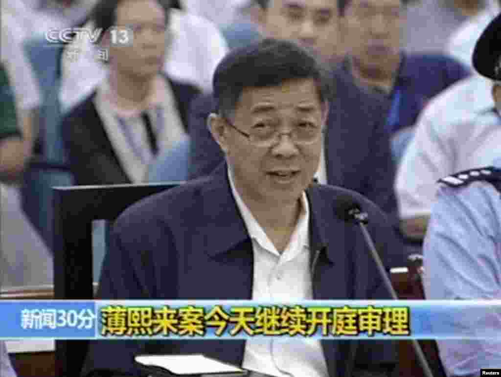In this image taken from video, Bo Xilai addresses a court at Jinan Intermediate People's Court in eastern China's Shandong province, Aug. 24, 2013.