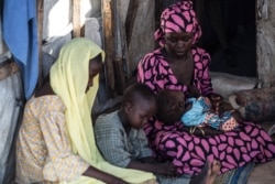 Aishatu Bulama has been reunited with her children, in Maiduguri, Nigeria. (C. Oduah/VOA)