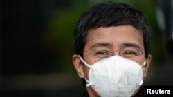 Rappler CEO Maria Ressa is pictured outside a regional trial court after the arraignment in her second cyber libel case, in Makati, Metro Manila, Philippines, Dec. 15, 2020. 