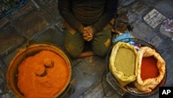 A Nepalese spice vendor waits for customers at Ason market in Katmandu, Nepal, Tuesday, Feb. 5, 2013. Ason is one the busiest and oldest market in Katmandu. (AP Photo/Niranjan Shrestha)