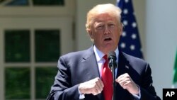 A man takes food from a basket as Italy struggles to contain the spread of coronavirus disease (COVID-19), in Naples.