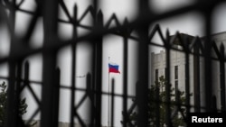 FILE - The Russian flag flies above the Embassy of the Russian Federation, near the Glover Park neighborhood of Washington, Feb. 22, 2022.