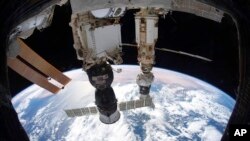 FILE - This Dec. 6, 2021, photo provided by NASA shows the International Space Station orbiting 425 kilometers above the Tyrrhenian Sea.