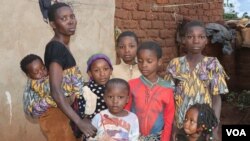 Neema, a DRC refugee says in the absence of WFP food aid she feels her family of 8 children is 'buried alive'. (Lameck Masina/VOA)