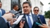 FILE - Honduran President Juan Orlando Hernandez answers questions from the media, Aug. 13, 2019, in Washington.