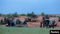 FILE - Malian soldiers are seen during a patrol in Dansongo Circle, Mali, Aug. 23, 2021. The Mauritanian government has accused Mali of “criminal acts” against Mauritanians on Malian territory.