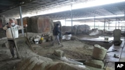 Excavations are carried out inside the 'House of the library' at the Pompeii archaeological site, Feb. 15, 2022. (AP Photo/Gregorio Borgia)