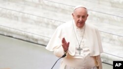 Pope Francis arrives at the opening of a three-day Symposium on Vocations in the Paul VI hall at the Vatican, Feb. 17, 2022. 