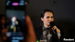 FILE - Belarus opposition leader Sviatlana Tsikhanouskaya speaks with members of the Belarusian community in Vilnius, Lithuania, Sept. 11, 2020.