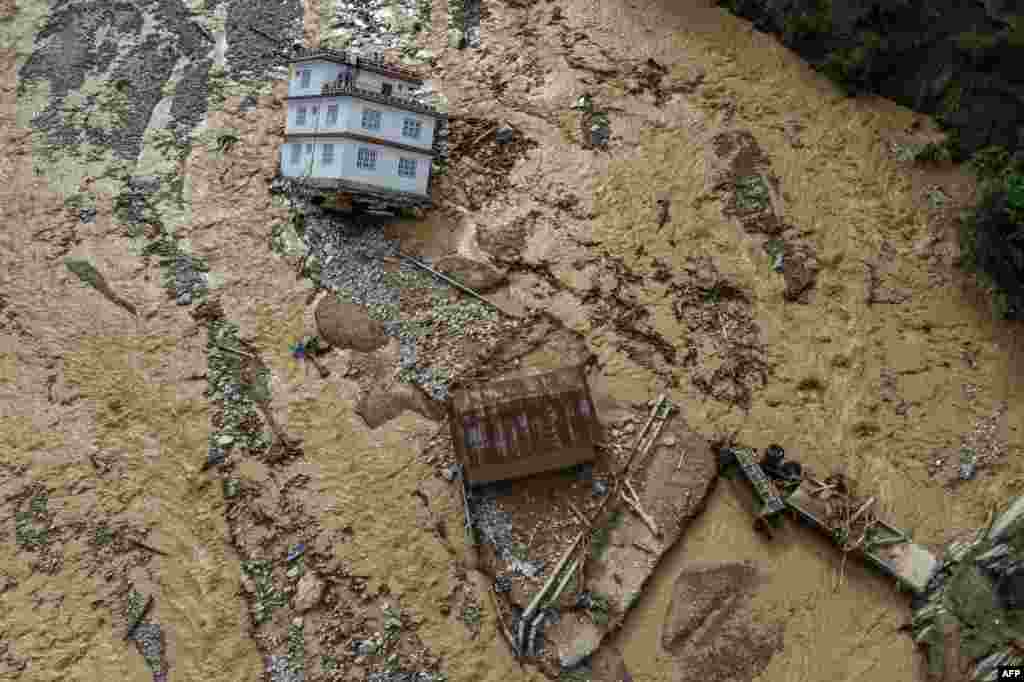 An aerial view shows the area affected by monsoon flooding in Roshi village of Nepal&#39;s Kavre district, Sept. 30, 2024.&nbsp;&nbsp;Search and rescue teams in Nepal&#39;s capital picked through wrecked homes after waters receded from monsoon floods that killed at least 209 people around the Himalayan republic.&nbsp;