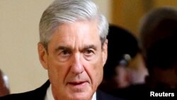 FILE - Special Counsel Robert Mueller departs after briefing members of the U.S. Senate on his investigation into potential collusion between Russia and the Trump campaign on Capitol Hill in Washington.