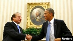 FILE - U.S. President Barack Obama shakes hands with Pakistan's Prime Minister Nawaz Sharif in the Oval Office at the White House in Washington, Oct. 23, 2013.