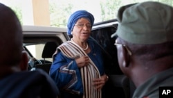 FILE - Liberia's President Ellen Johnson Sirleaf arrives at the Capitol to address lawmakers in Monrovia, Liberia.