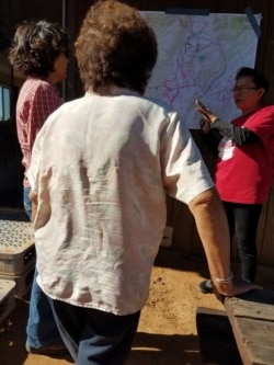 Volunteer citizens planning a search and rescue operation after a 94-year-old elder went missing, Sept. 17, 2019.