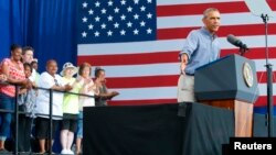 U.S. President Barack Obama delivers remarks at Laborfest 2014 at Maier Festival Park in Milwaukee, Wisconsin, Sept. 1, 2014.