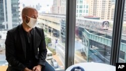 FILE - Dr. Demetre Daskalakis, New York City deputy health commissioner, speaks to a reporter on battling the coronavirus pandemic through contact tracing in New York, Aug. 12, 2020.