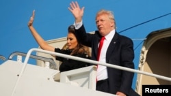 President Donald Trump and first lady Melania Trump wave outside Air Force One before returning to Washington D.C. at Sigonella Air Force Base in Sigonella, Sicily, Italy, May 27, 2017.