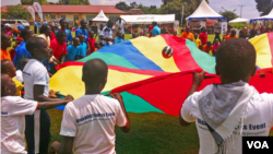 Children with disabilities at play in a rehabilitation center known as CoRSU (Comprehensive Rehabilitation Services for Uganda), Kampala, Uganda, Nov. 13, 2014. (Elizabeth Paulat/VOA)