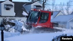 A snow plough clears the snow, following a winter storm that struck the region, in Buffalo, New York, Dec. 25, 2022, in this picture obtained by Reuters from social media on Dec. 26, 2022. Instagram/Jason Murawski Jr/via REUTERS