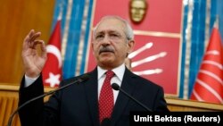 FILE - Turkey's main opposition Republican People's Party (CHP) Leader Kemal Kilicdaroglu addresses his party MPs during a meeting at the Turkish parliament in Ankara.