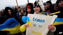 Crimean Tatars shout slogans during the pro-Ukraine rally in Simferopol, Crimea, Ukraine, March 10, 2014. 