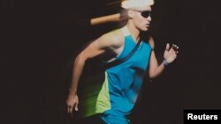 A model presents a garment from a collection made up of up to 50% recycled polyester cycora, at an unknown location, in this handout photo released on Oct. 25, 2023. (Inditex via Reuters)