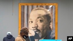 Chicago residents participate Oct. 15, 2020, in early voting at the Dr. Martin Luther King, Jr. Center in Chicago. 