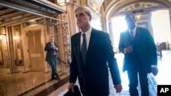 FILE - Special counsel Robert Mueller departs after a closed-door meeting with members of the Senate Judiciary Committee about Russian meddling in the election and possible connection to the Trump campaign, at the Capitol in Washington, June 21, 2017.