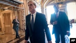 FILE - Special counsel Robert Mueller departs after a closed-door meeting with members of the Senate Judiciary Committee about Russian meddling in the election and possible connection to the Trump campaign, at the Capitol in Washington, June 21, 2017.