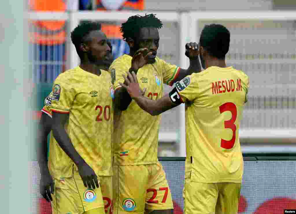 Ethiopia&#39;s Dawa Hotessa celebrates scoring their first goal against Cameroon with teammates.