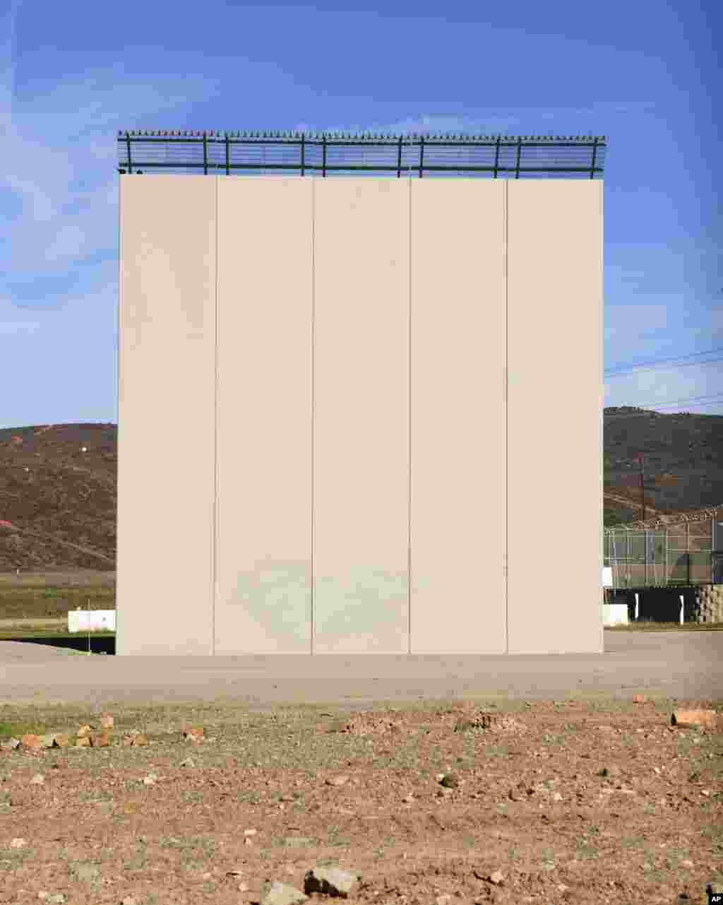 A border wall prototype stands in San Diego near the Mexico-U.S. border, seen from Tijuana, Mexico, Dec. 22, 2018. 
