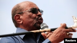 FILE - Sudan's President Omar al-Bashir addresses supporters during his visit to the war-torn Darfur region, in Bilal, Darfur, Sudan Sept. 22, 2017. 