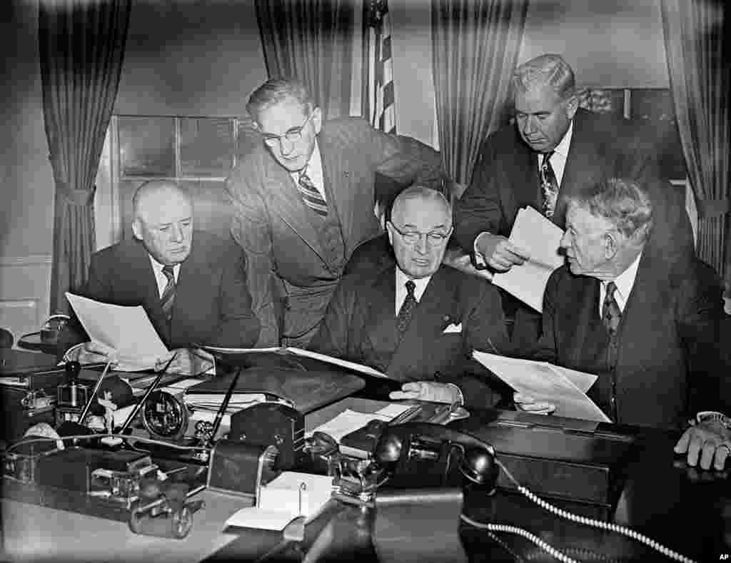 President Harry Truman checks the final draft of his &ldquo;State of the Union&rdquo; speech with congressional leaders before going to the capitol to deliver it, Jan. 8, 1951.