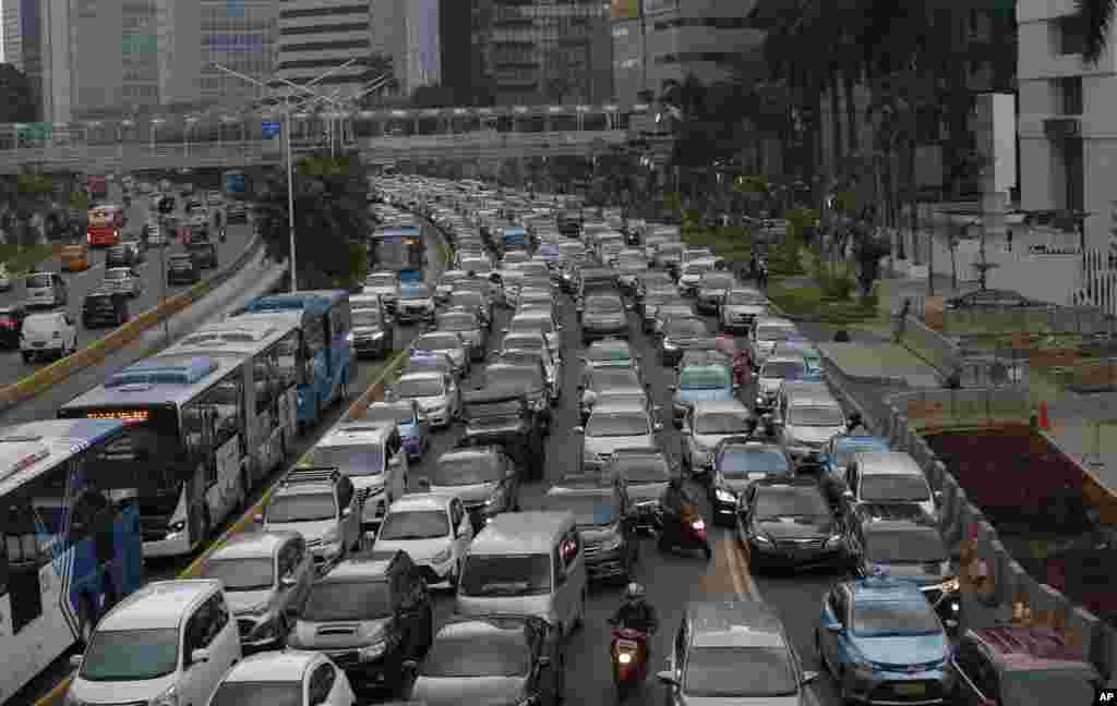 FILE - Motorists are stuck in traffic jam during a rush hour at the main business district in Jakarta, Indonesia, Dec. 11. 2018.