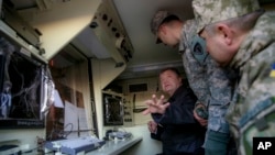 Ukrainian President Petro Poroshenko inspects U.S. counterbattery radar stations for the armed forces of Ukraine in Lviv, Nov. 14, 2015.