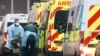 Medics help a patient out of an ambulance at the Royal London Hospital, amid the coronavirus outbreak, in London, Britain, Jan. 5, 2021. 