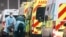 Medics help a patient out of an ambulance at the Royal London Hospital, amid the coronavirus outbreak, in London, Britain, Jan. 5, 2021. 