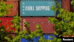  FILE - Shipping containers are stacked at the Paul W. Conley Container Terminal in Boston, May 9, 2018. According to Chinese data, China's trade surplus with the United States rose $24.58 billion in May.