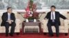 A Macau government handout picture shows Chinese President Xi Jinping (R) meeting with Macau Chief Executive Fernando Chui at the San Chok Un Guesthouse in Macau, Dec. 19, 2014. 