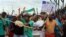 Mine workers sing and dance outside the Lonmin's platinum mine in Marikana near Rustenburg, South Africa, Thursday, Jan. 30, 2014. The Association of Mineworkers and Construction Union (Amcu) on Thursday rejected a 9% wage offer from leading platinum prod