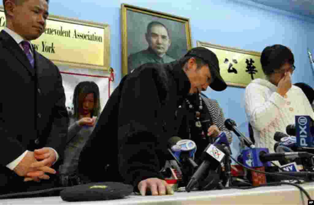 City comptroller John Liu, far left, listens as the father of Pvt. Danny Chen, Yan Tao Chen, center, speaks while his mother Su Zhen Chen, far right, weeps during a press conference in New York, Thursday, Jan. 5, 2012. (AP Photo)