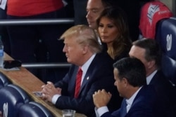 President Donald Trump watches during the second inning of Game 5 of the baseball World Series between the Houston Astros and the Washington Nationals, Oct. 27, 2019, in Washington.