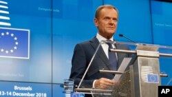 European Council President Donald Tusk speaks during a media conference at an EU summit in Brussels, Dec. 14, 2018. 
