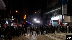 FILE - Police arrive to chase away protestors in Hong Kong, Jan. 1, 2020. 